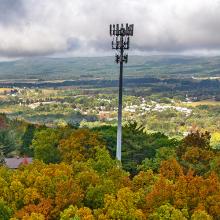 FirstNet is Transforming Communications for First Responders in Luzerne County U.S. Congressman Rob Bresnahan with FirstNet Authority personnel, local first responders, public safety officials, and community leaders standing in front of new FirstNet cell tower site; aerial view of the new, rural tower in Luzerne County, Pennsylvania