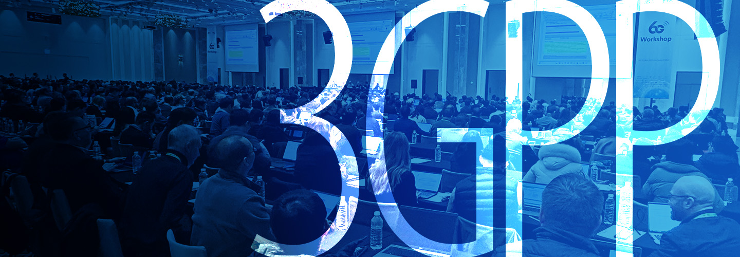A group of people dressed in business attire taking notes on electronic devices while seated in a large conference room with three oversized presentation screens at the 3GPP 6G workshop; “3GPP”   