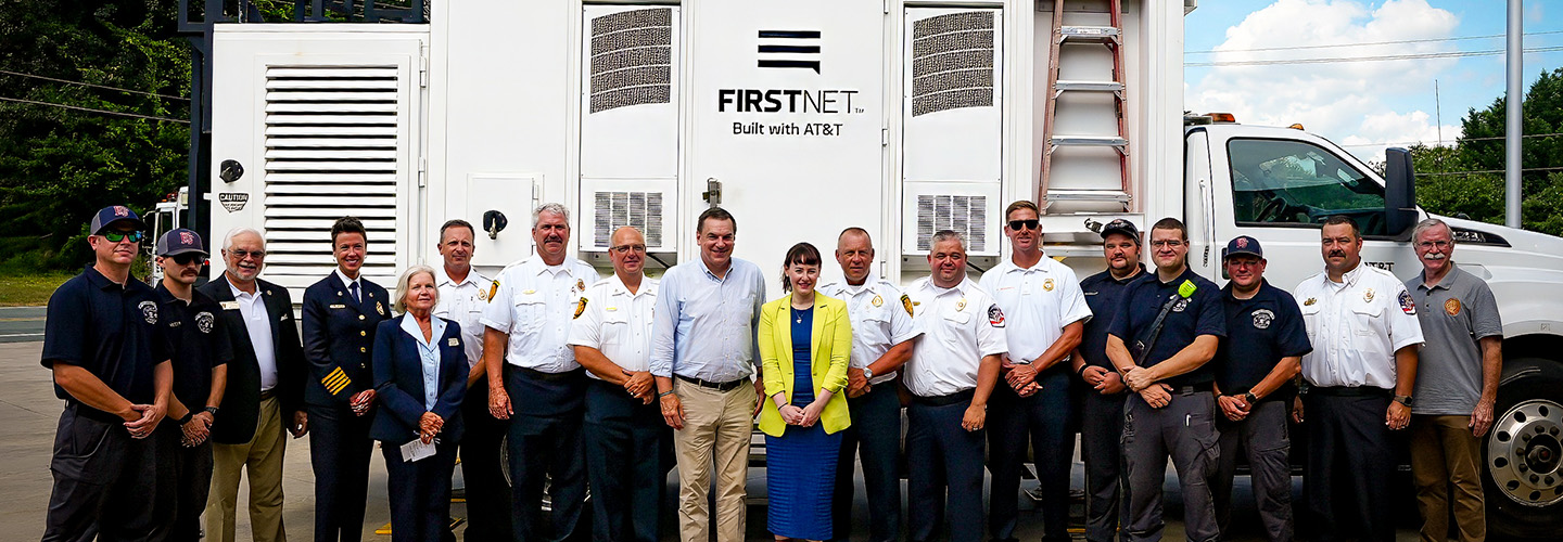 Congressman Richard Hudson, Assistant Secretary of Commerce for Communications and Technology Arielle Roth, and Elon, North Carolina first responders; FirstNet SatCOLT