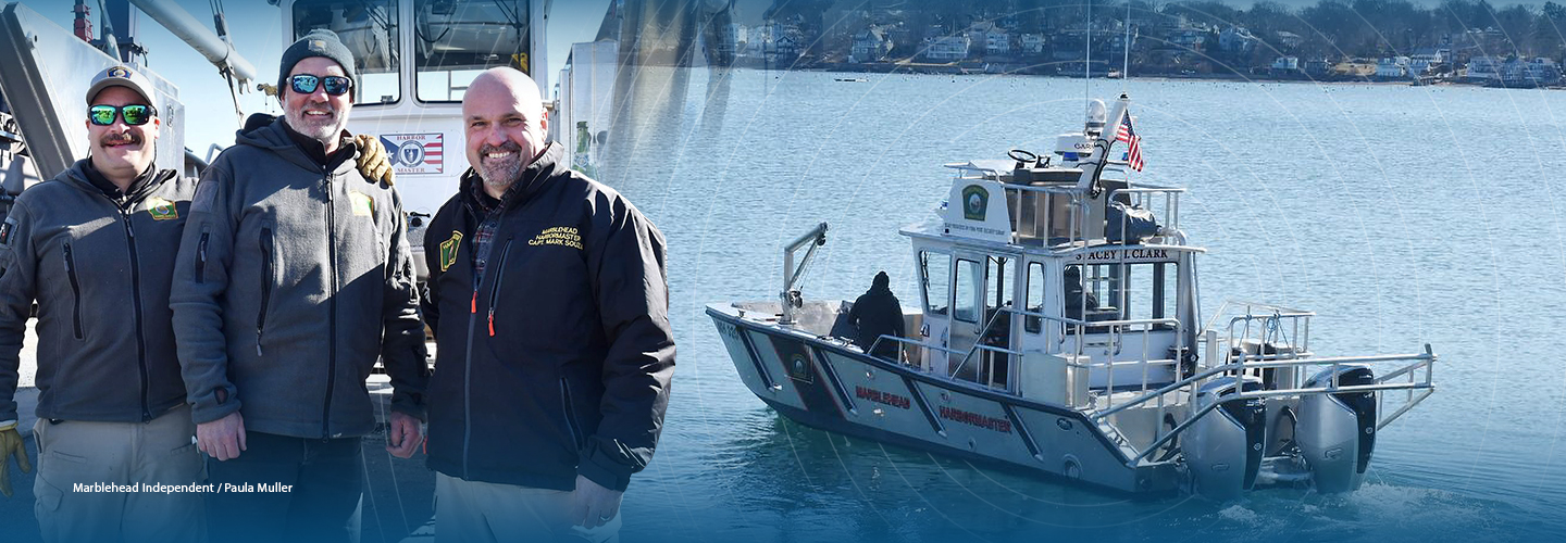 On the left, Assistant Harbormaster Jarret Russo, Deputy Harbormaster Craig Smith, and Harbormaster Mark Souza stand at the bow of the Stacey H. Clark while on the right, the same boat sails off the coast of Massachusetts on its maiden voyage. 