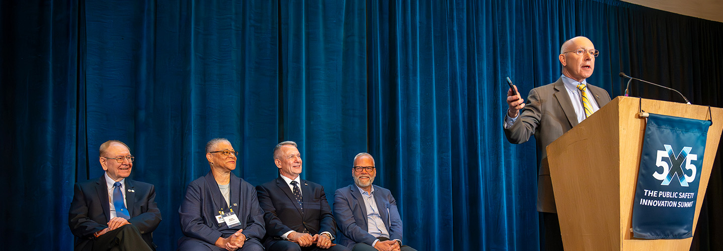 Bill Schrier speaks on stage after receiving the McEwen Award 