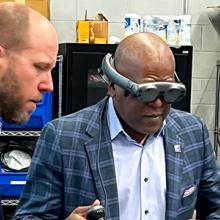 The First Responder Network Authority board chair Stephen Benjamin wearing a pair of virtual reality goggles during a lab tour. The First Responder Network Authority board chair Stephen Benjamin wearing a pair of virtual reality goggles during a lab tour.
