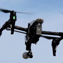 A DJI Inspire 1 drone flies in the air. A DJI Inspire 1 drone flies in the air.