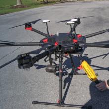 Police officer prepares drone on street; Public Safety First podcast logo; “Eyes in the Sky: Drones and FirstNet” Police officer prepares drone on street; Public Safety First podcast logo; “Eyes in the Sky: Drones and FirstNet”