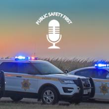  Public Safety First Podcast logo; "FirstNet is 'Force Multiplier' for Nebraska Sheriff's Office;" Buffalo County Sheriff's Office trucks, SUV, and cruiser parked on road next to a field; a sunset