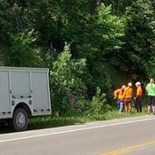 Emergency first responders along the side of a highway
