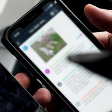 Two smartphones held by a responder