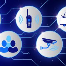 Representing a virtual emergency operations center (EOC), a FirstNet-equipped phone with lines connecting to icons representing various aspects of emergency response 