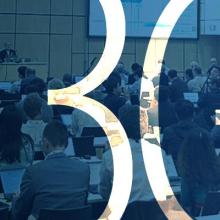 3GPP focuses on Release 20 6G and 5G-Advanced, including key public-safety needs Panel discussion at the June 2025 3GPP meeting with participants seated at conference tables; two large projection screens behind the panel show presentation slides; “3GPP”