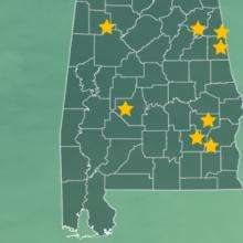 The State of Alabama, with outlined county borders; a cell tower.
