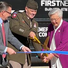Deputy Commanding General of Army Materiel Command Lieutenant General Donnie Walker cuts a ribbon held by FirstNet Authority Board member Chief Richard Carrizzo, Alabama Governor Kay Ivey, and AT&T Alabama President Wayne Hutchens in front of a FirstNet Emergency Mobile Communications truck. Deputy Commanding General of Army Materiel Command Lieutenant General Donnie Walker cuts a ribbon held by FirstNet Authority Board member Chief Richard Carrizzo, Alabama Governor Kay Ivey, and AT&T Alabama President Wayne Hutchens in front of a FirstNet Emergency Mobile Communications truck.