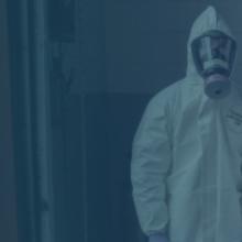 Two EMS workers wearing hazmat suits Two EMS workers wearing hazmat suits