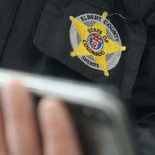 Elbert County Sheriff Norton holding a FirstNet-enabled phone 