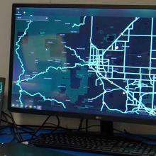 A man setting up an Emergency Operations Center in a new space.