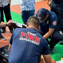 FirstNet in 2024: A Year of Growth, Innovation, and Bold Plans for the Future Members of the FirstNet Authority team and the Commonwealth of the Northern Mariana Islands Fire Department kneeling on the ground to demonstrate FirstNet assets during a multi-jurisdictional incident response communications exercise.