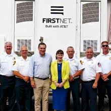 Congressman Richard Hudson, Assistant Secretary of Commerce for Communications and Technology Arielle Roth, and Elon, North Carolina first responders; FirstNet SatCOLT