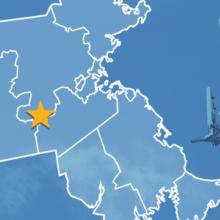 State of Massachusetts with counties outlined; a star locating Holliston, a cell tower