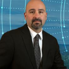 Jasper Bruner; a tree-covered hill with a broadband tower; an abstract design of interconnected circular lines and dotted lines radiation out from the center 