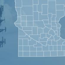 The state of Minnesota, with outlined county borders and a star locating Lewiston, Minnesota; a cell tower.