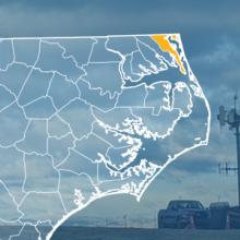 The FirstNet Network Expands in Currituck County to Advance Public Safety Communications Capabilities The state of North Carolina, with outlined county borders; a cell tower.