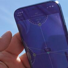 “Device-focused research enhances FirstNet user experience;" FirstNet Authority logo; a person using a smartphone