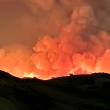 Advanced communications during wildfires: Lessons from the Orange County Airport Fire The 2024 Airport Fire burns just beyond the ridge of Southern California’s Santa Ana Mountains while heavy smoke fills the sky.