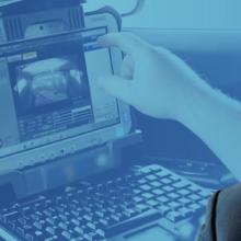 Peter Koutoujian headshot; a police officer using a laptop in the front seat of a cruiser
