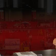 FirstNet Authority Senior Public Safety Advisor Gary McCarraher sits at table across from Chief Charles Doody of the Canton Fire Department in Massachusetts.