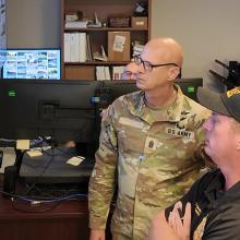 Staff at the Redstone Arsenal look at maps simulating a chemical plume response 