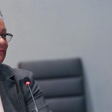 Renee Gordon at at FirstNet Authority Board meeting Renee Gordon in front of a microphone at at FirstNet Authority Board meeting