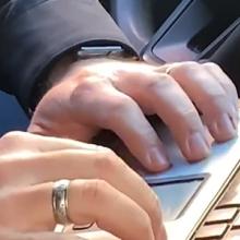 A law enforcement officer types on a computer. A law enforcement officer types on a computer.