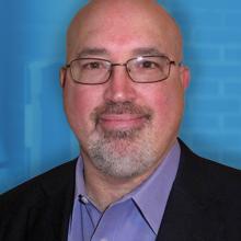 APCO’s Steve Devine talks tech trends in 9-1-1 A headshop of Steve Devine, Chief Technology Officer for the Association of Public-Safety Communications Officials International; an ambulance with the message “Dial 911” written on the side.