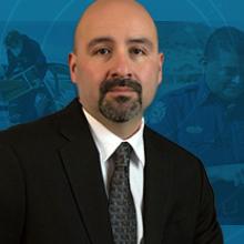 Headshot of the FirstNet Authority’s Tribal Government Liaison Jasper Bruner; two volunteers loading supplies onto an airplane; a responder using a FirstNet-enabled device to communicate in a rural area; a public safety officer in an emergency response vehicle; the FirstNet Authority’s board member Paul Patrick speaking at a cell site ground-breaking ceremony on tribal lands.