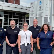 Winnebago County Sheriff’s Office, FirstNet Authority and FirstNet Built with AT&T and AT&T personnel in front of a SatCOLT outside.
