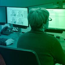 Bruce Fitzgerald headshot; two emergency managers monitoring a storm on their computers Bruce Fitzgerald headshot; two emergency managers monitoring a storm on their computers