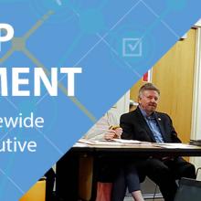 Photo of a group of public safety officials meeting with the FirstNet Authority in New Hampshire with a graphic overlay that reads New Hampshire Roadmap Engagement.