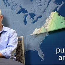 Man sitting at a table with a map of the United States and enlargedColor outline topographic map of the state of Virginia behind him on a blue background