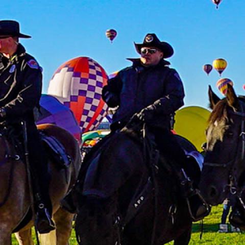 Four officers on horses during the Albuquerque International Balloon Fiesta
