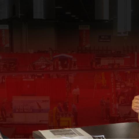 FirstNet Authority Senior Public Safety Advisor Gary McCarraher sits at table across from Chief Charles Doody of the Canton Fire Department in Massachusetts.