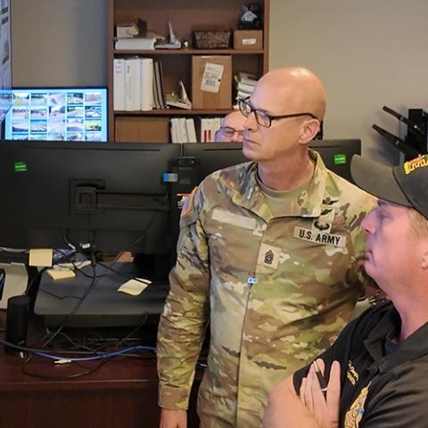 Staff at the Redstone Arsenal look at maps simulating a chemical plume response 