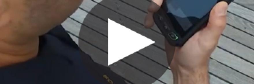 Atlantic City Police Department officer using a smart phone