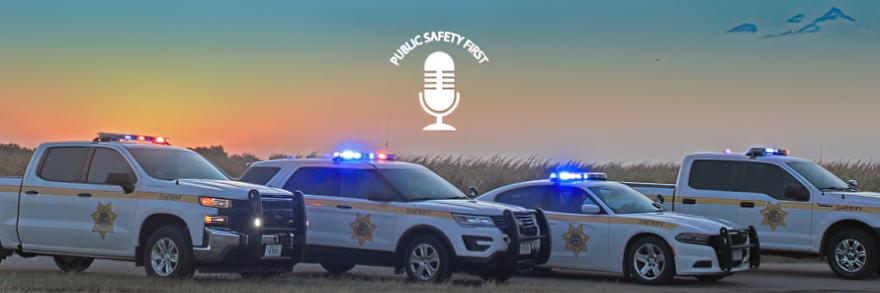  Public Safety First Podcast logo; "FirstNet is 'Force Multiplier' for Nebraska Sheriff's Office;" Buffalo County Sheriff's Office trucks, SUV, and cruiser parked on road next to a field; a sunset