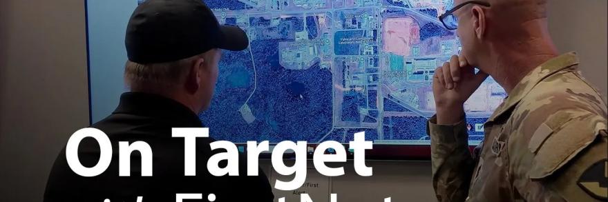 Army soldier and First responder looking at screen with text overlay " On Target with FirstNet"   