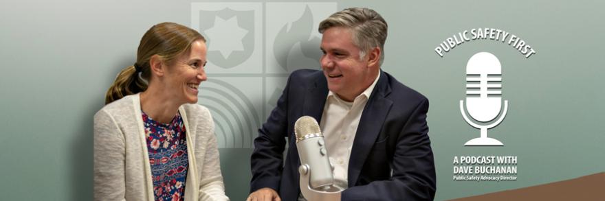 Host Dave Buchanan interviews Amanda Hilliard in front of a microphone on a table