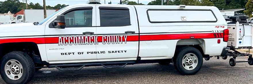 An Accomack County Department of Public Safety pickup truck with a compact rapid deployable (CRD) loaded on the hitch