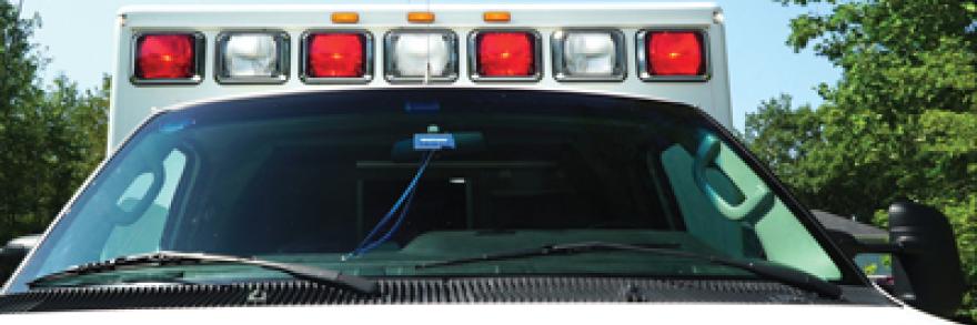 Front view of an ambulance, including its lights. 
