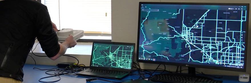 A man setting up an Emergency Operations Center in a new space.