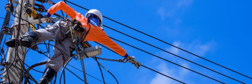 A powerline worker repairing electrical wires