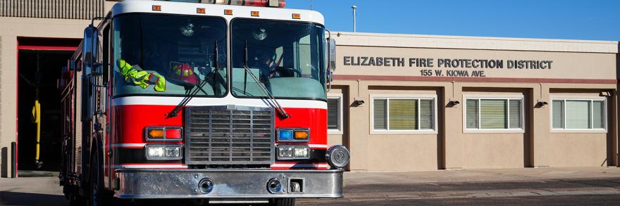A fire truck parked in front of the Elizabeth Fire Protection District station.
