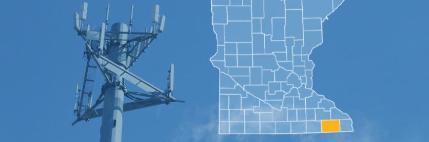 The state of Minnesota, with outlined county borders and Fillmore County highlighted; a cell tower